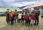 TNI dan Warga Ilaga: Kebersamaan Hangat Membangun Harapan di Papua